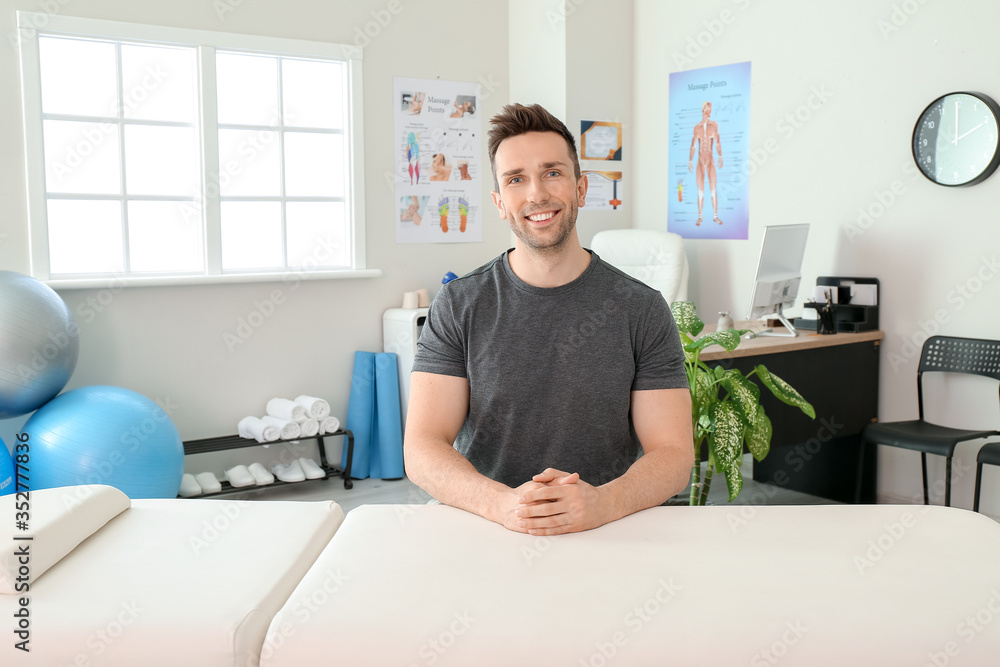 Portrait of massage therapist in medical center