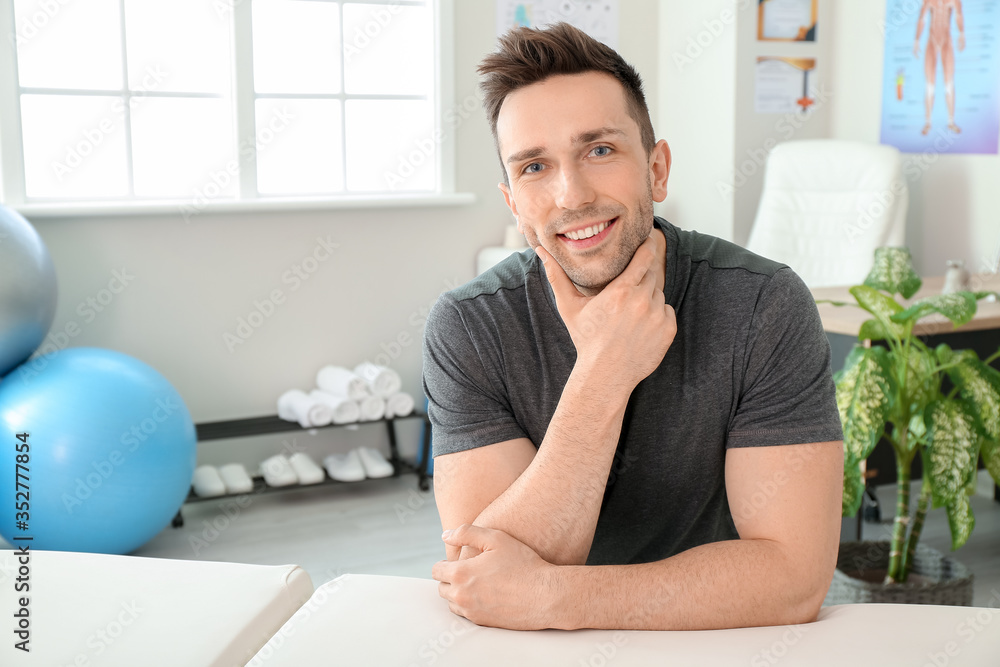 Portrait of massage therapist in medical center