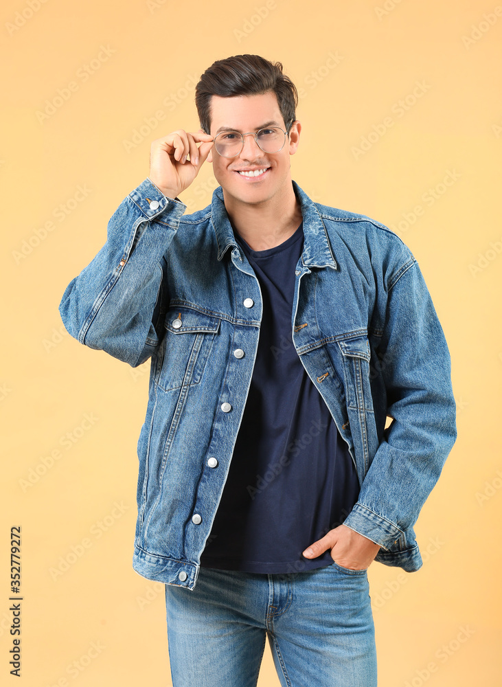 Portrait of handsome stylish man on color background