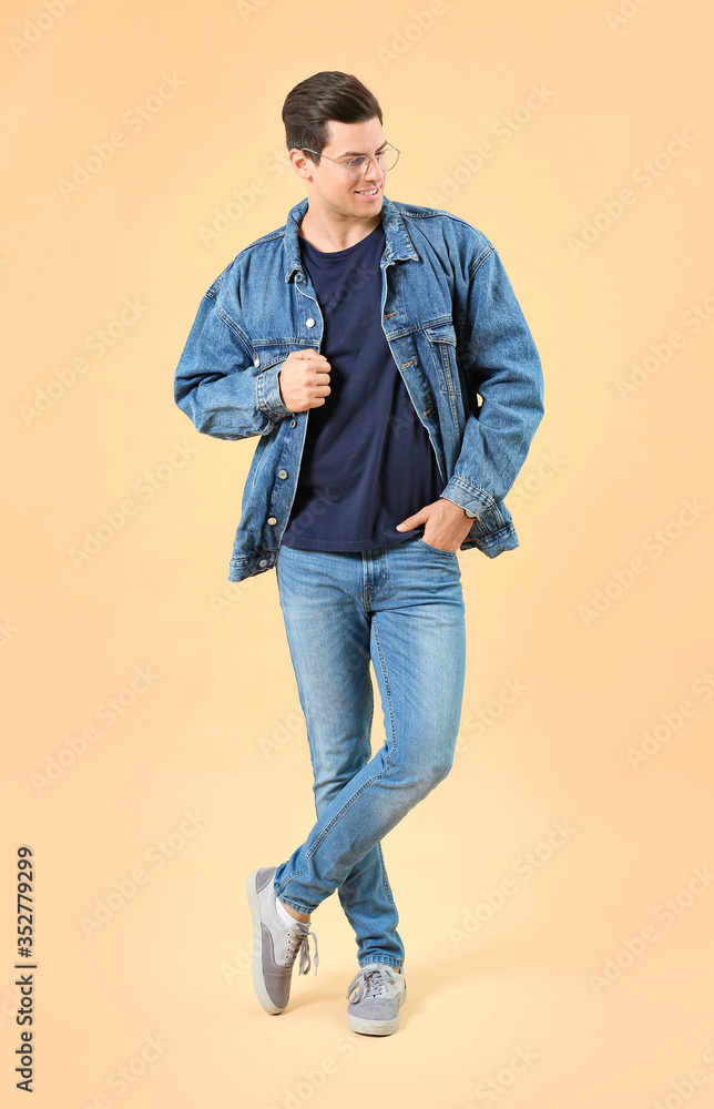 Portrait of handsome stylish man on color background