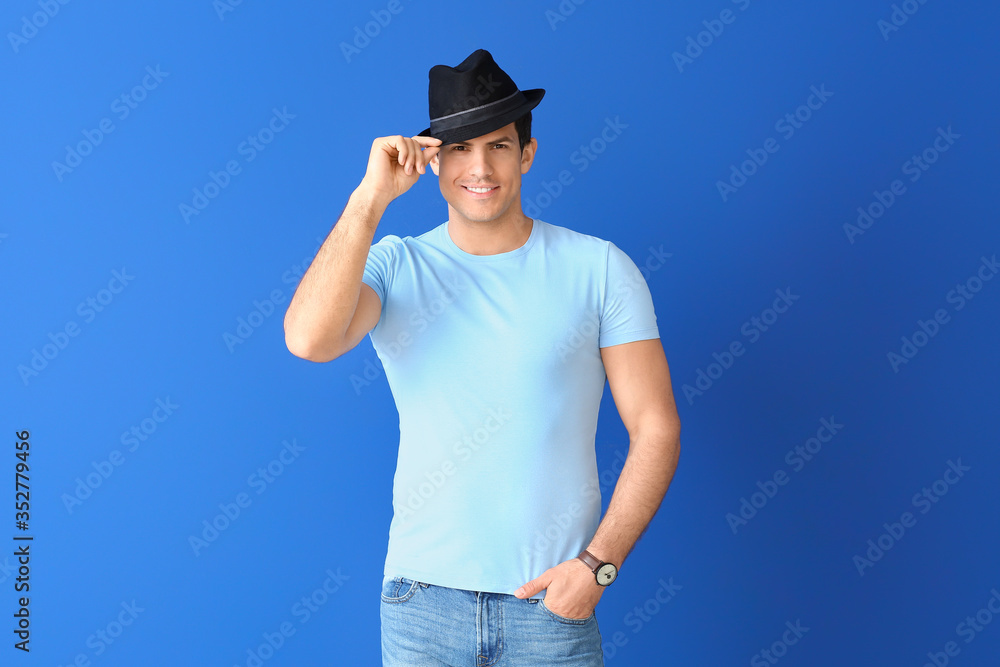 Man in stylish t-shirt on color background