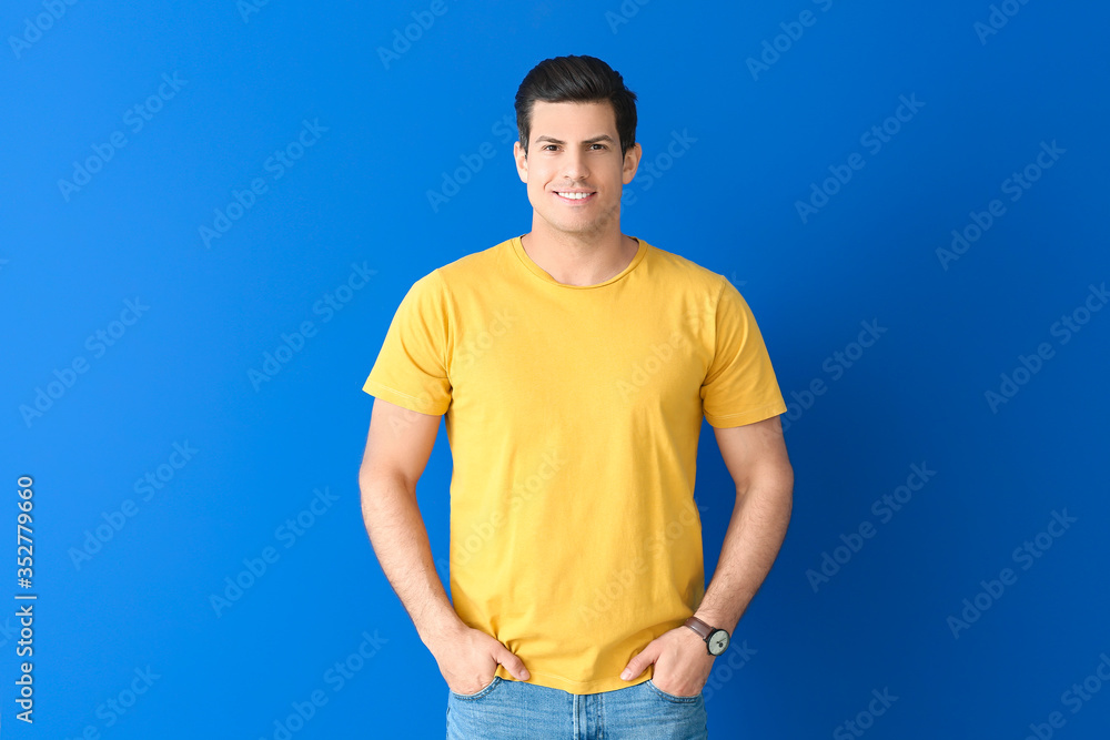 Man in stylish t-shirt on color background