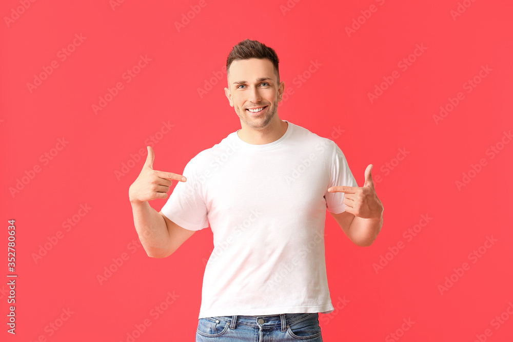 Man in stylish t-shirt on color background