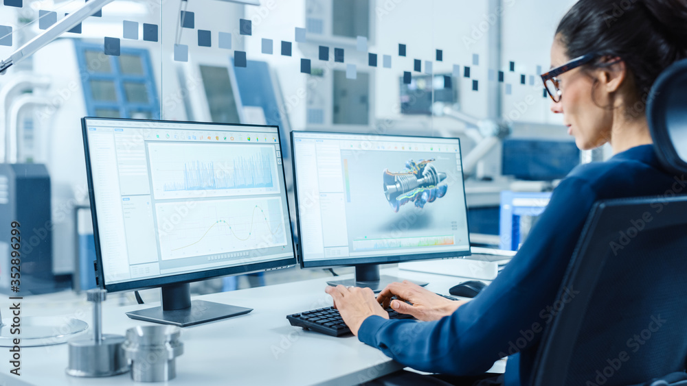 Industrial Female Engineer Working on a Personal Computer, Two Monitor Screens Show CAD Software wit