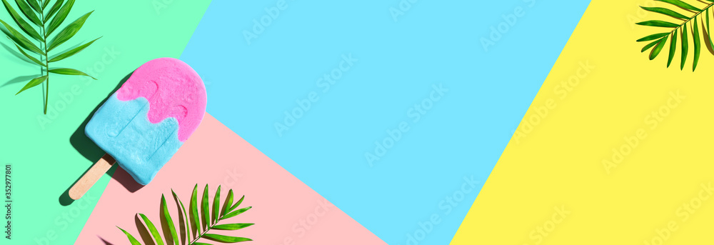 Popsicle with tropical plants - overhead view flat lay