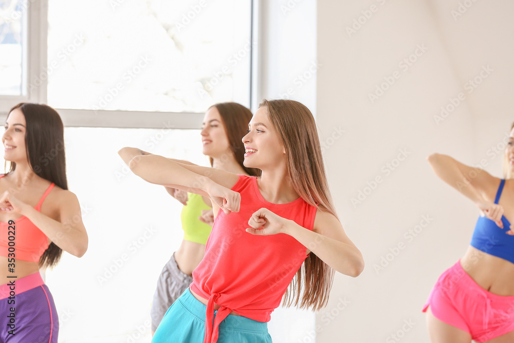 Beautiful young women dancing in studio