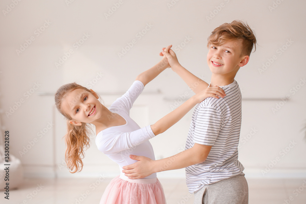 Cute little children dancing in studio