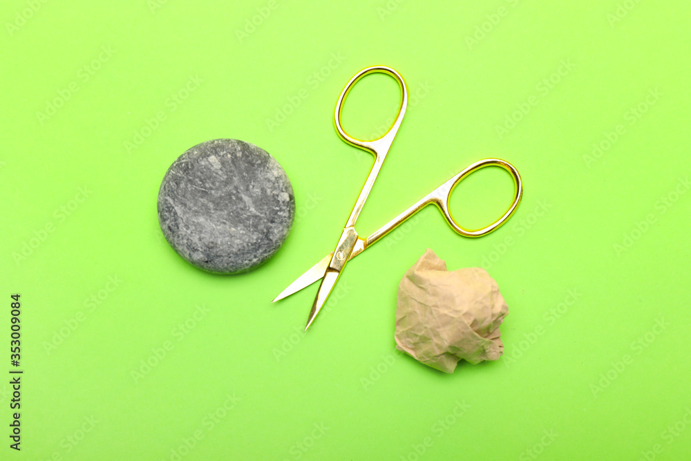 Scissors, rock and paper on color background