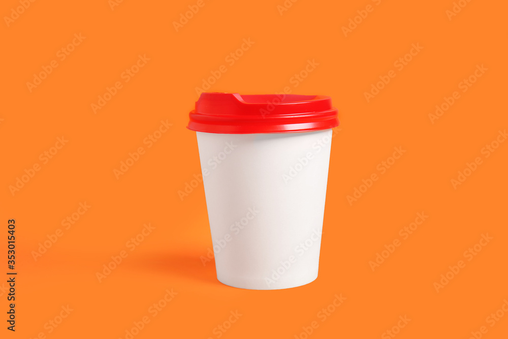 Takeaway cup for drink on color background