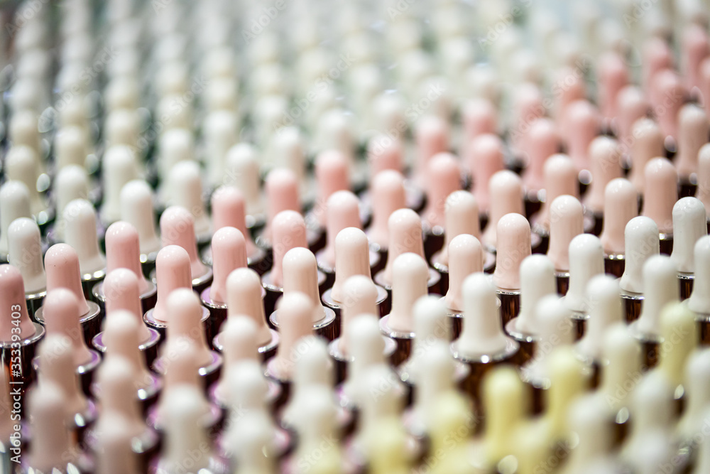 Set of cosmetic bottles in rows, equipment for beauty store