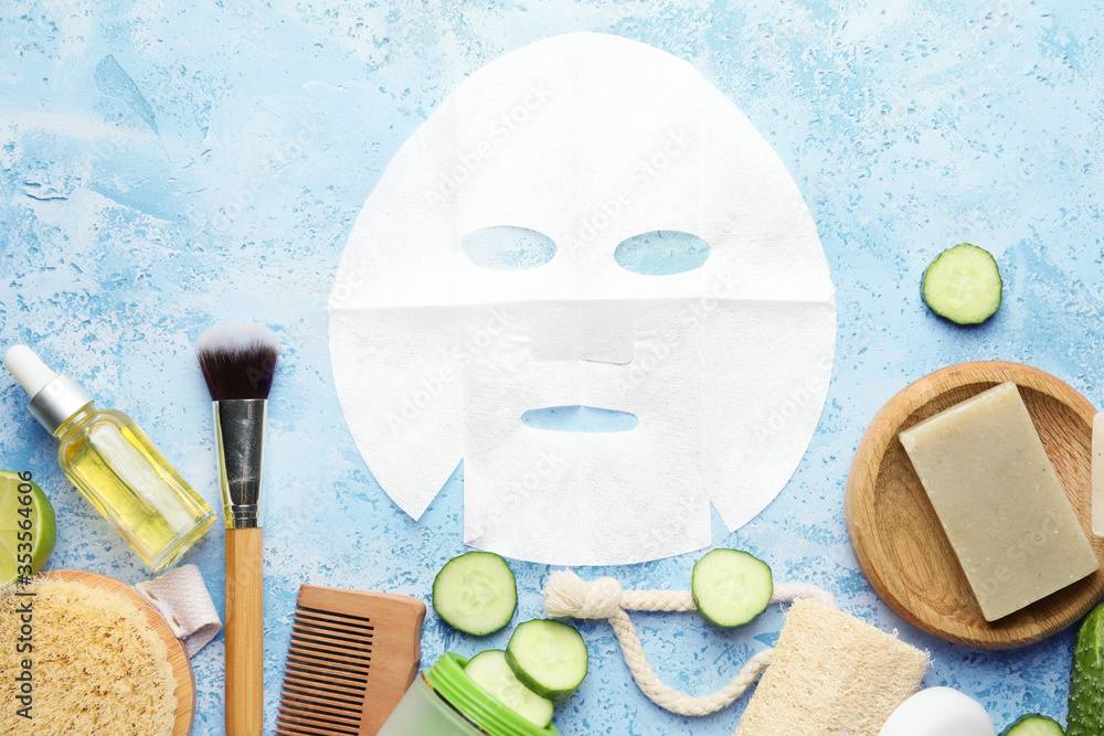 Composition with cucumber, bath supplies and cosmetics on color background