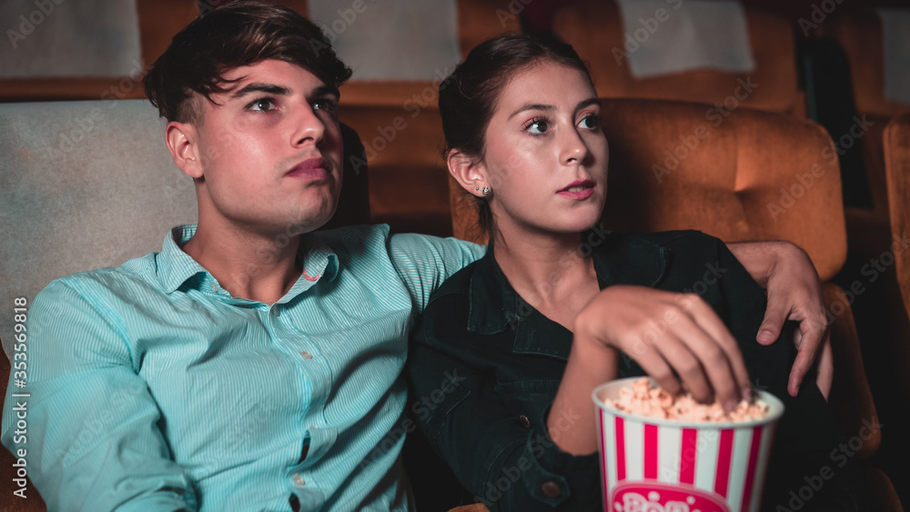 People audience watching movie in the movie theater cinema. Group recreation activity and entertainm