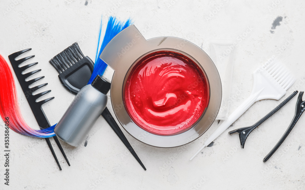 Supplies for hair coloring on white background