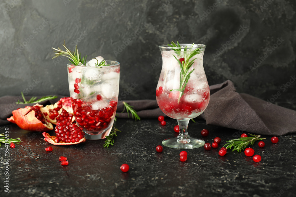 Glasses of healthy cocktail on dark background