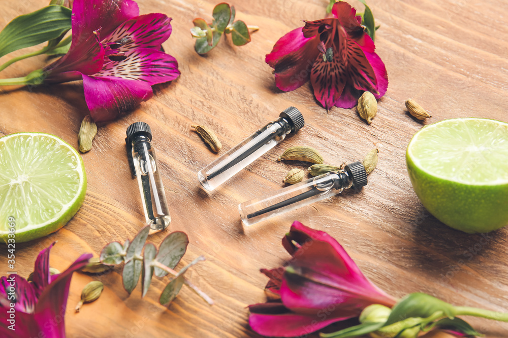 Perfume samples on wooden background