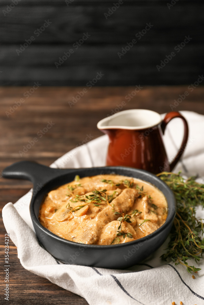 Tasty beef stroganoff on table