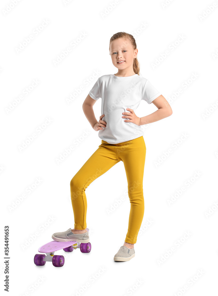 Sporty little girl with skateboard on white background