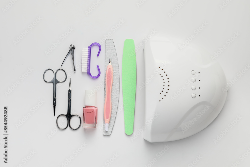 Supplies for manicure on white background