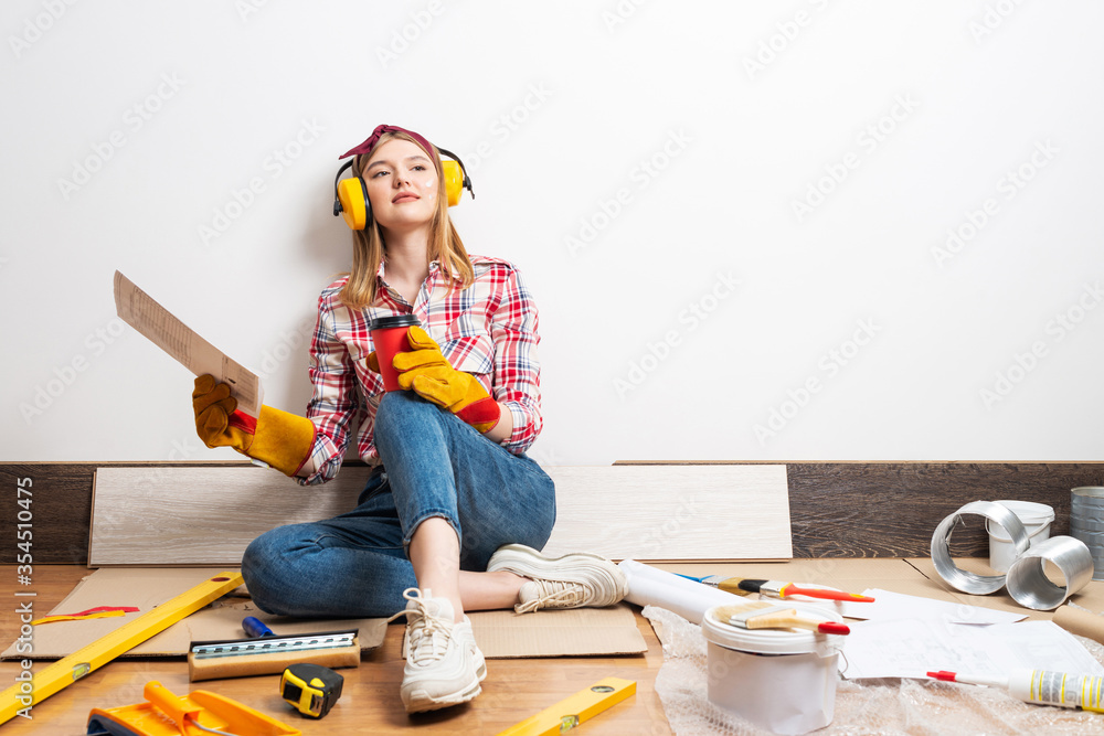 Dreamy girl in protective headphones and gloves