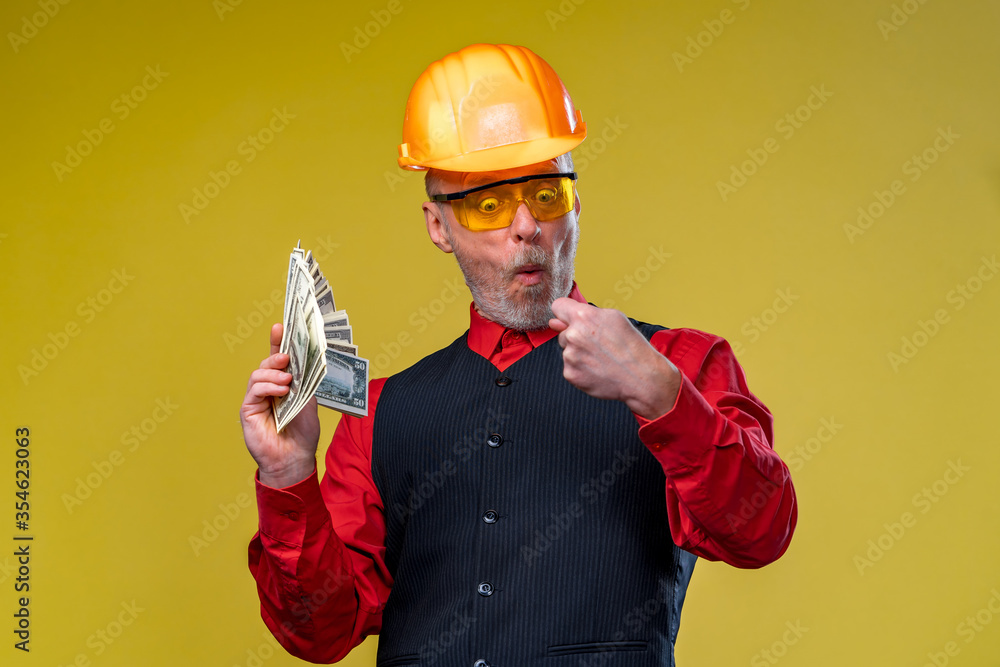 Serious general contractor or real estate investor concept with elegant man with beard, glasses and 