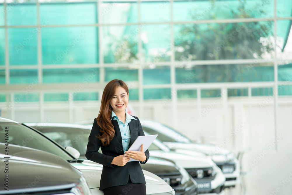 Professional salesperson selling cars at car showroom,Customer buying new car concept.