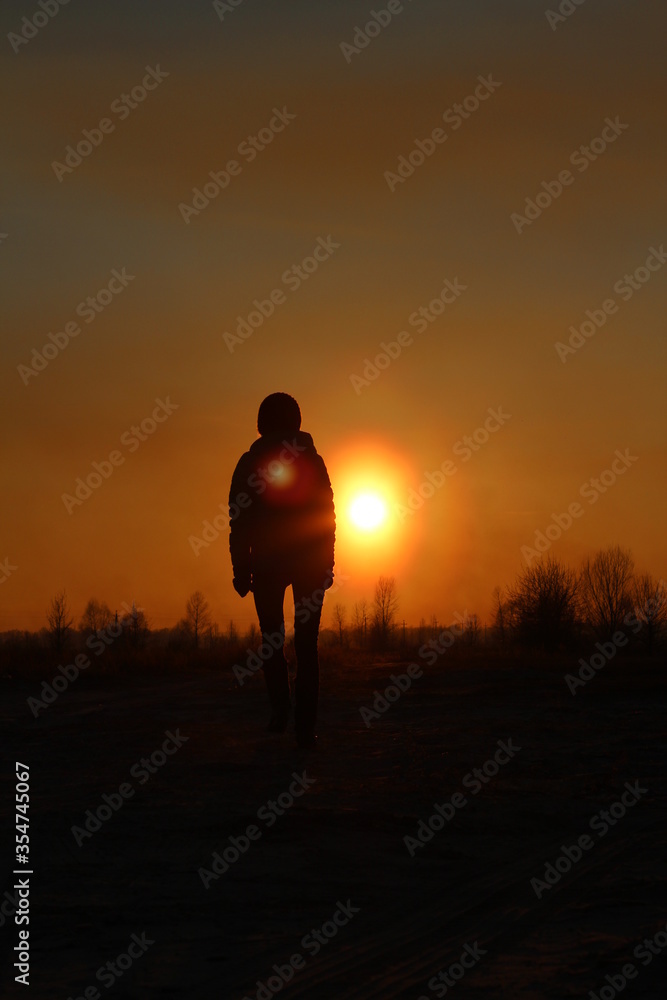 girl in the shade at sunset