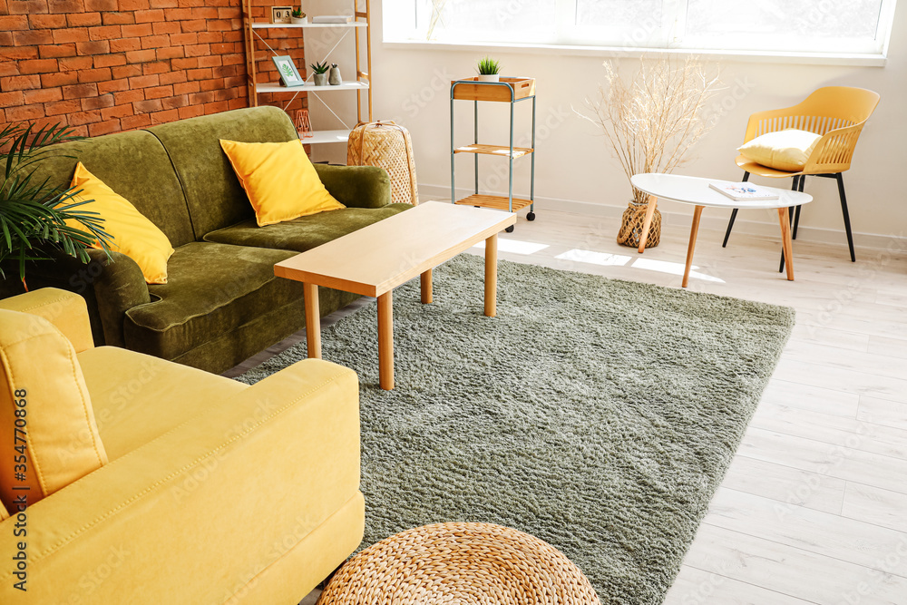 Stylish interior of living room with carpet