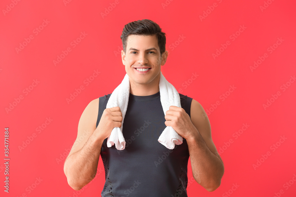 Sporty young man on color background