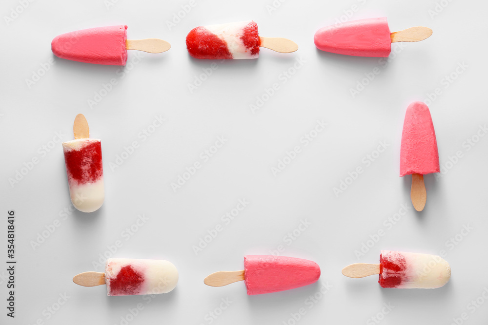 Frame made of tasty strawberry ice cream on light background