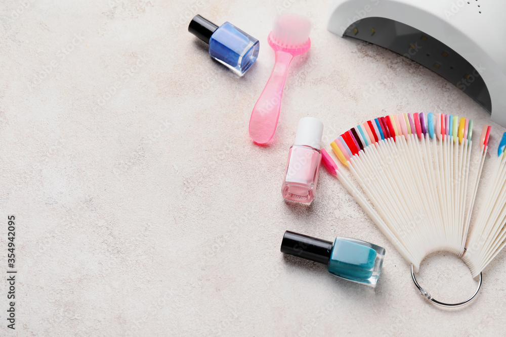 Supplies for manicure on light background