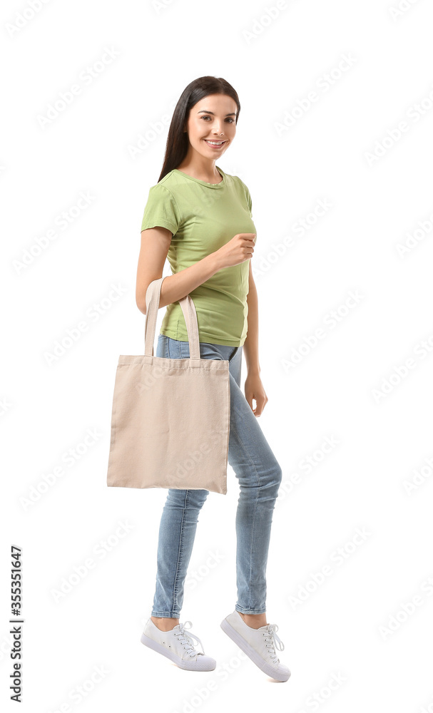 Young woman with eco bag on white background