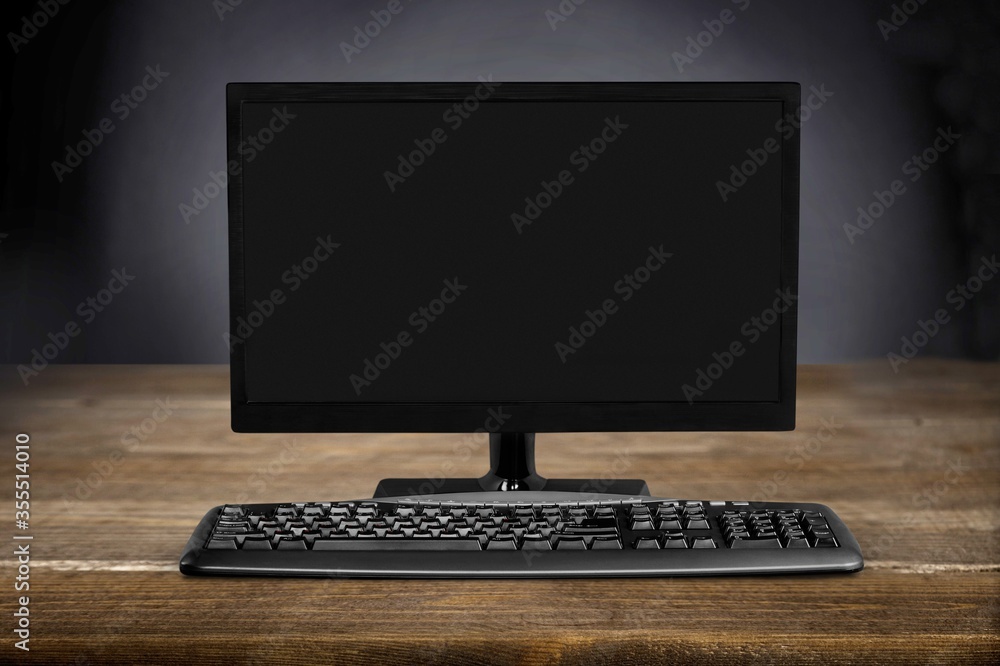 Modern desktop computer and keyboard on desk