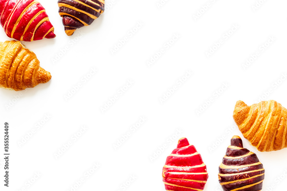 Frame of croissants - fresh bakery on white background. Top view