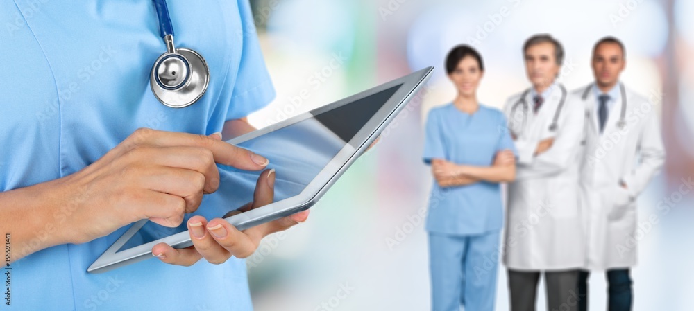 Doctor at hospital working with tablet pc