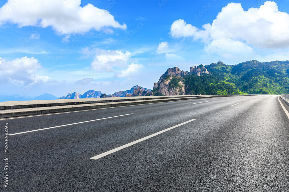 Mountain road and sky cloud natural landscape.Asphalt road background.