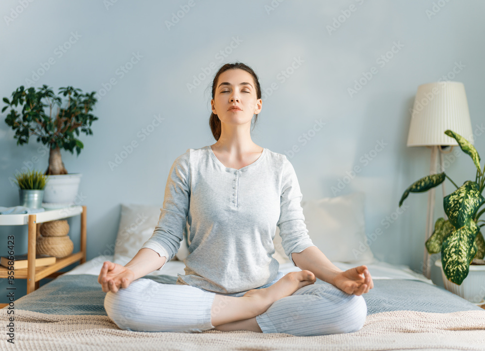 woman enjoying sunny morning and practicing meditation