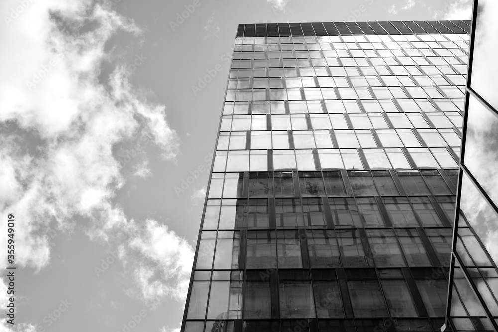 Urban geometry, looking up to glass building. Modern architecture, glass and steel. Abstract modern 