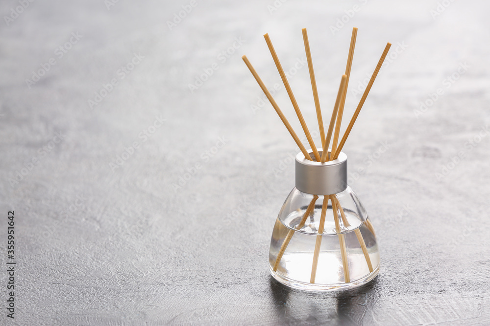 Reed diffuser on grey table