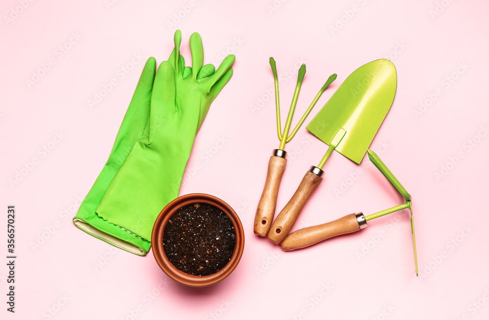 Set of gardening supplies on color background