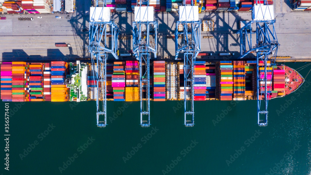 Container cargo ship at industrial port in import export global business worldwide logistic and tran