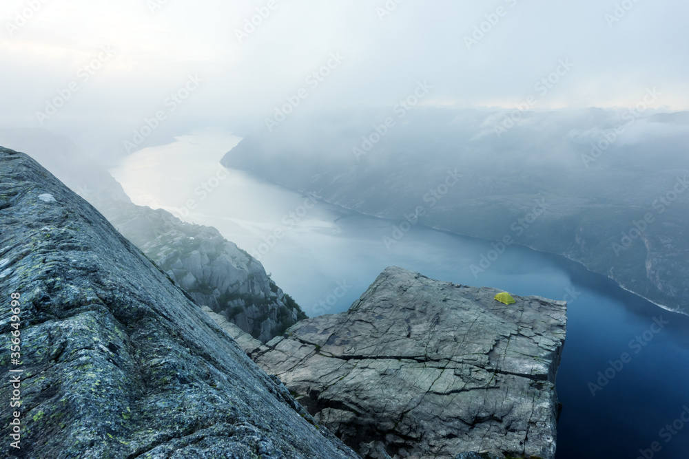 Alone tent near Trolltunga rock - most spectacular and famous scenic cliff in Norway