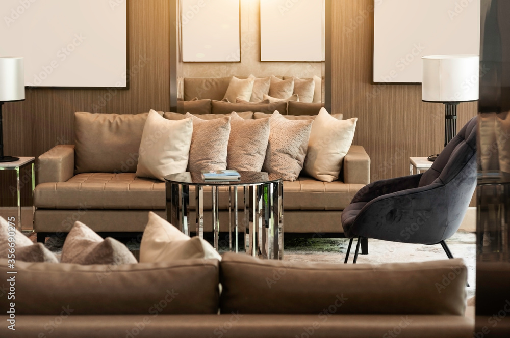 Lobby living room earth tone color, cozy luxury sofa and pillow,