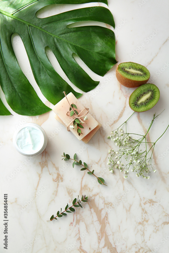 Natural cosmetics with ingredients on table