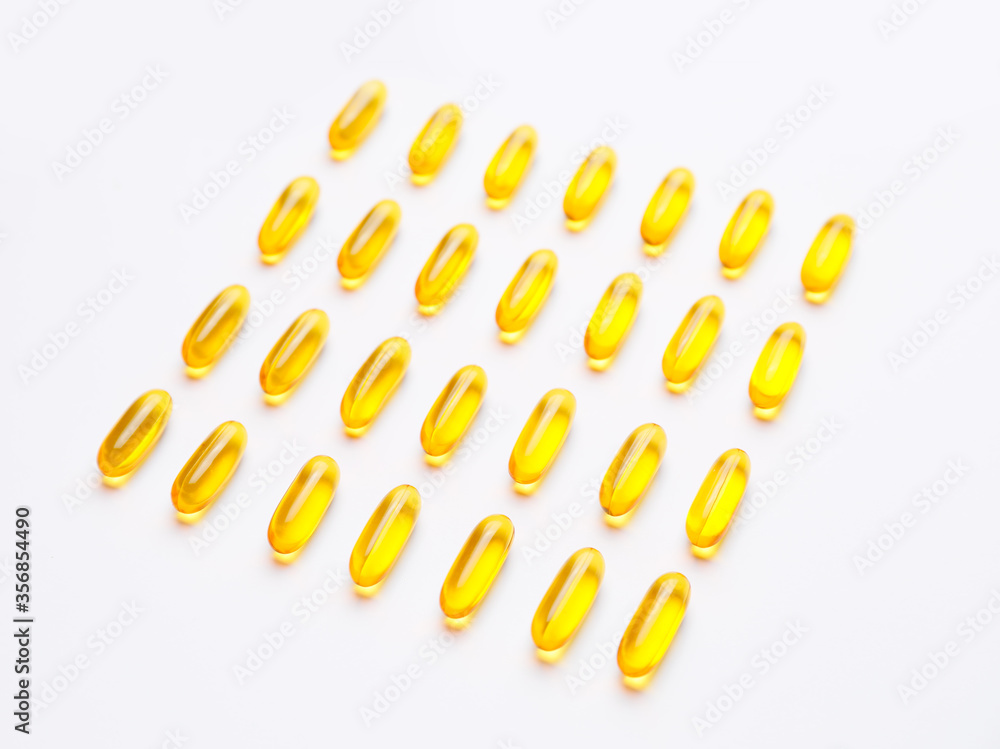 Fish oil capsules on white background