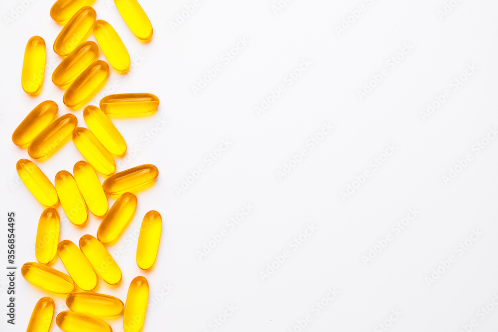 Fish oil capsules on white background