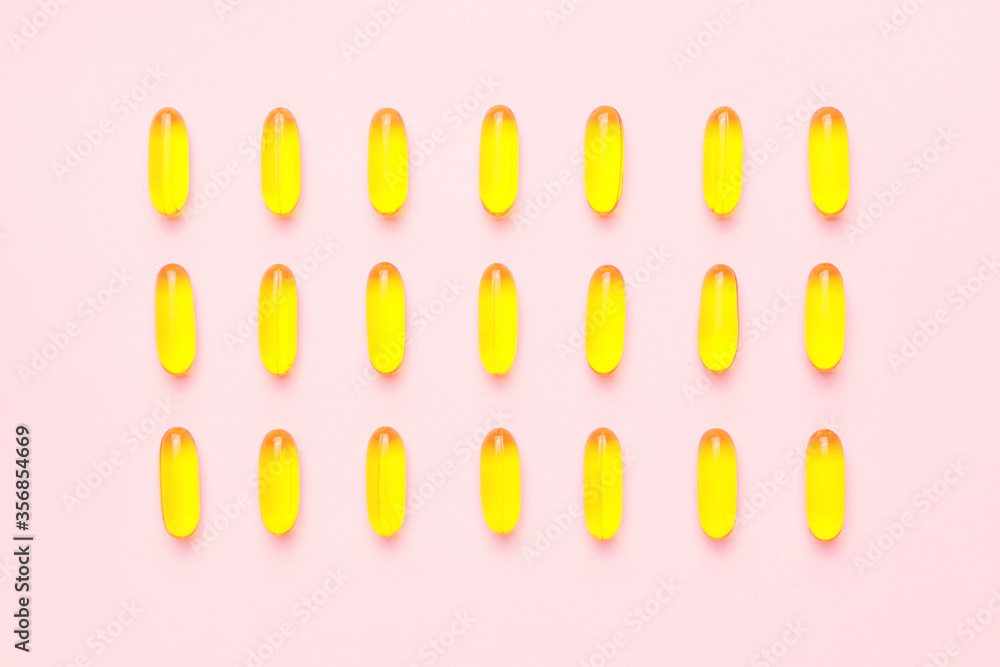 Fish oil capsules on color background