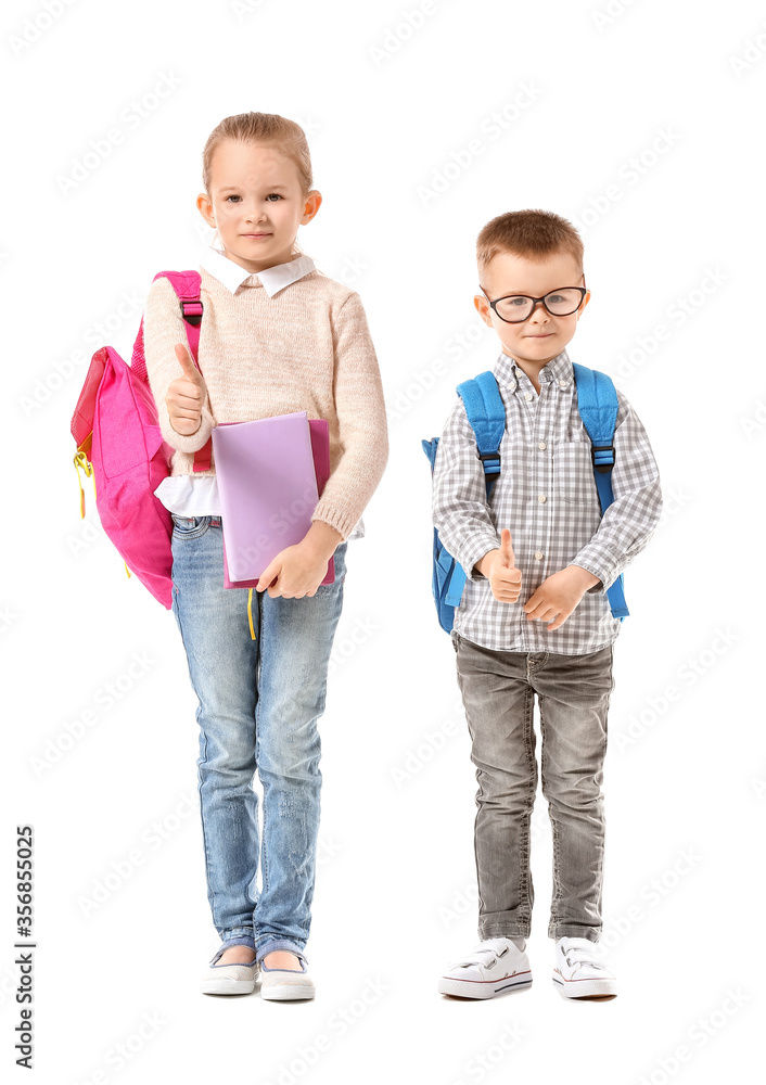 Cute little pupils showing thumb-up on white background