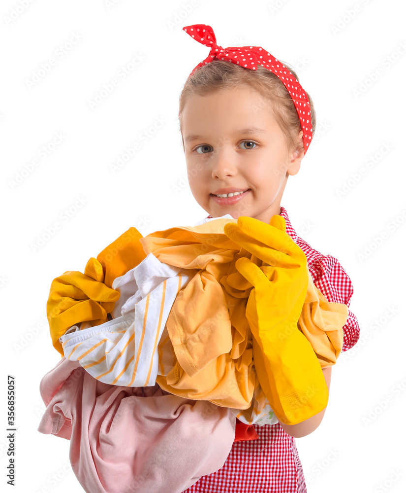 Little girl with dirty laundry on white background