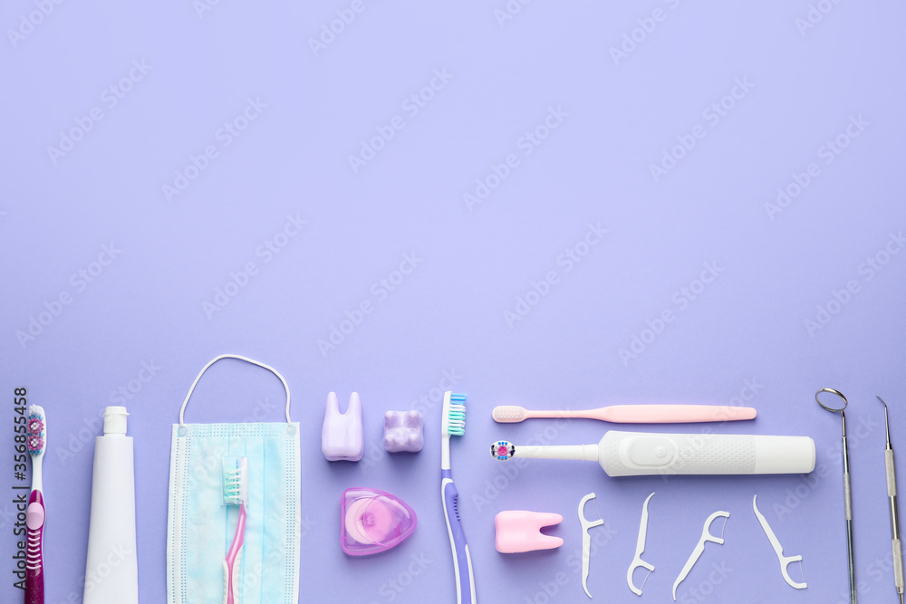 Set for oral hygiene with medical mask on color background