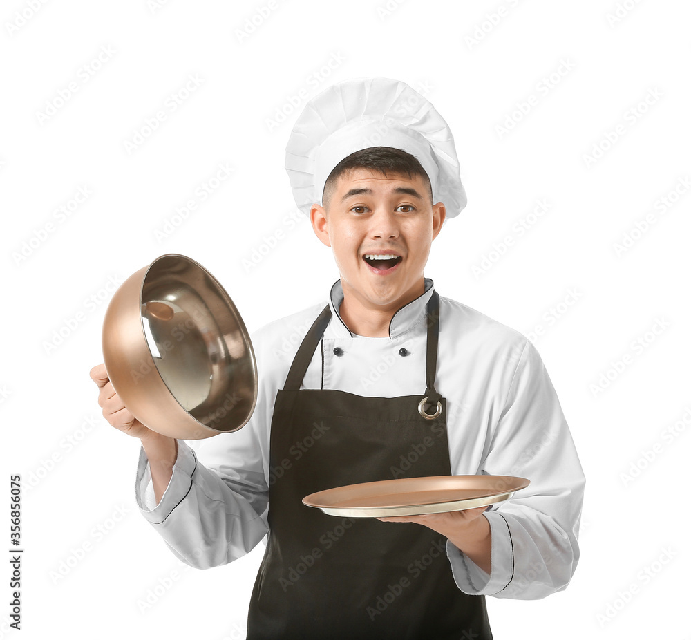 Handsome Asian chef with tray on white background